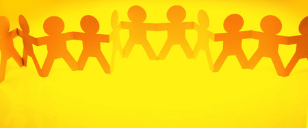 Paper chain team holding hands. Teamwork. Partnershipの写真素材