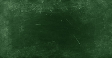 Chalk rubbed out on green chalkboard backgroundの写真素材