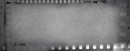 Film negative frames grey background. Copy spaceの写真素材