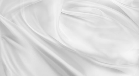 Rippled white silk fabric texture backgroundの写真素材