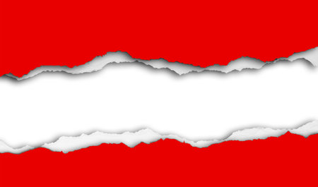 Hole ripped in red paper on white backgroundの写真素材