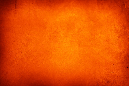 Orange textured concrete wall backgroundの写真素材
