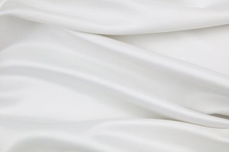 Rippled white silk fabric texture backgroundの写真素材