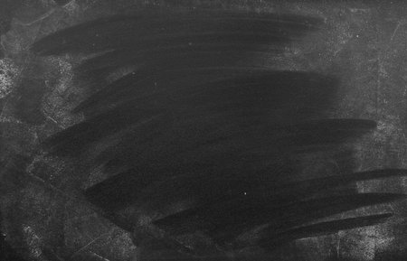Chalk rubbed out on blackboard backgroundの写真素材