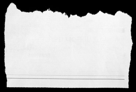 Piece of torn paper on blackの写真素材