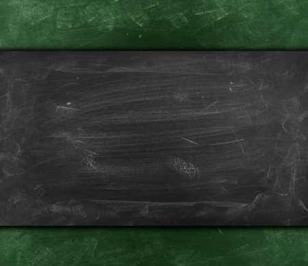 Chalk rubbed out on grey green chalkboard backgroundの写真素材