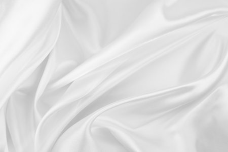 Rippled white silk fabric texture backgroundの写真素材