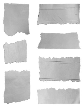 Seven pieces of torn paper on plain backgroundの写真素材