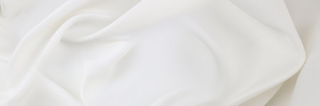 Rippled white silk fabric texture backgroundの写真素材