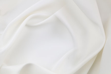 Rippled white silk fabric texture backgroundの写真素材