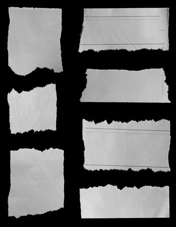 Seven pieces of torn newspaper on black backgroundの写真素材