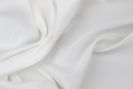 Rippled white silk fabric texture backgroundの写真素材