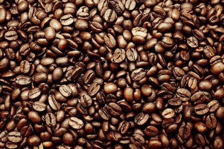 Close-up of roasted brown coffee beans backgroundの写真素材