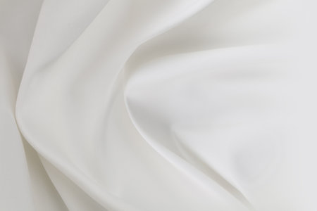 Rippled white silk fabric texture backgroundの写真素材