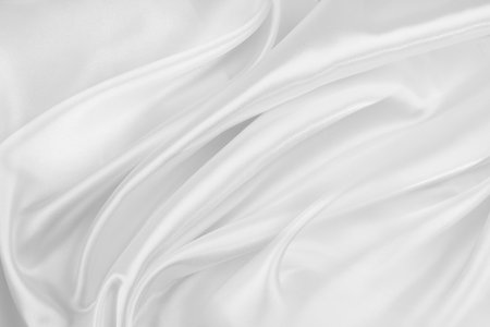 Rippled white silk fabric texture backgroundの写真素材