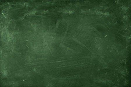 Chalk rubbed out on green chalkboard backgroundの写真素材