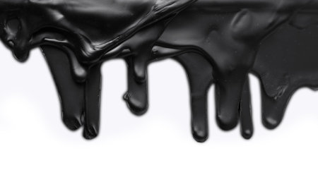Black paint drips on white backgroundの写真素材