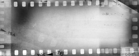 Film negative frames grey background. Copy spaceの写真素材