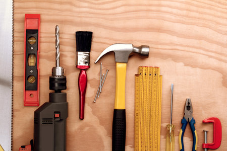 Assorted work tools on woodの写真素材
