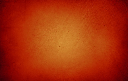 Orange textured concrete wall backgroundの写真素材