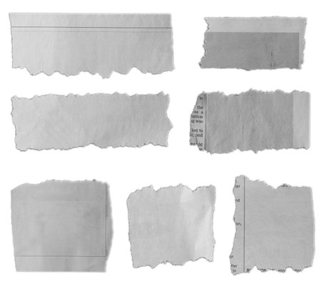 Seven pieces of torn paper on plain backgroundの写真素材