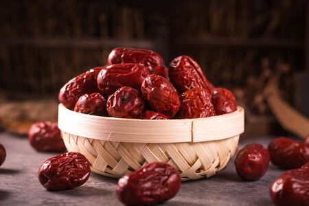 Dried jujube fruit on wooden tableの写真素材