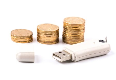 Golden coins stack and USB isolated on white background の写真素材