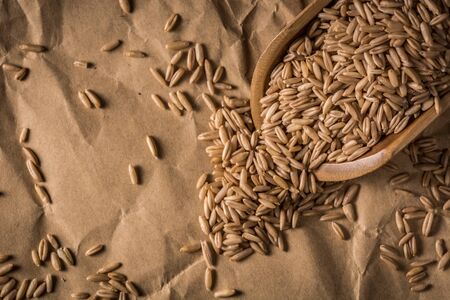 wheat grain on wooden tableの写真素材