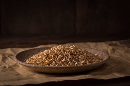 wheat grain on wooden tableの写真素材