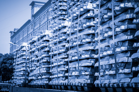 Stack of raw Aluminium Ingot on outdoor warehouseの写真素材