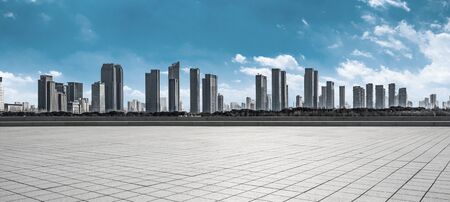 Empty floor with modern skyline and buildingsの写真素材