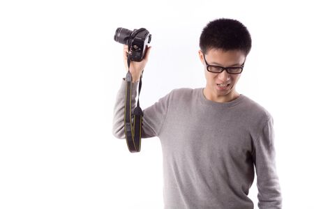 Young photographer taking pictures with digital cameraのeditorial素材