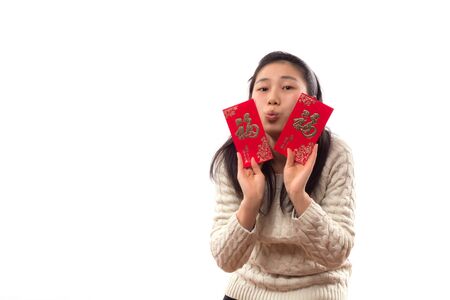 Asian woman holding  red packetsの写真素材