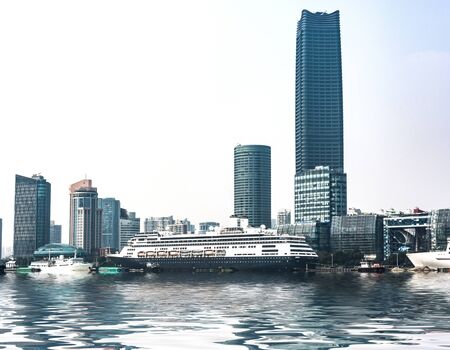 Business district cityscape from a park with blue skyの写真素材