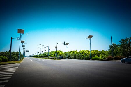 asphalt road and forestの写真素材