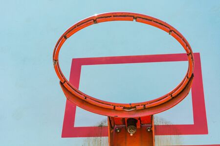 basketball hoop and backboard with blue skyの写真素材
