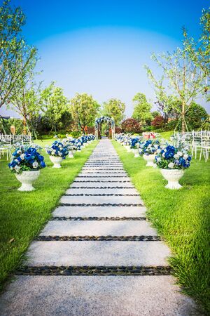 Beautiful wedding flower arrangement of seats along the aisleの写真素材