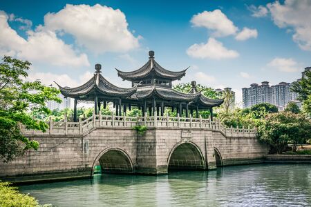 Old bridge in Chinese parkの写真素材