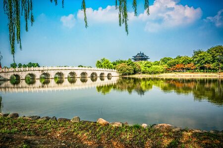 Old bridge in Chinese parkの写真素材