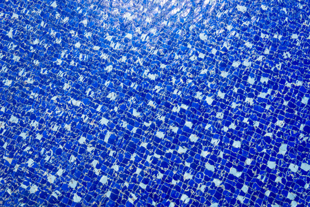 Blue swimming pool rippled water  background
