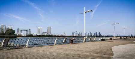 modern buildings beside the river at Chinaのeditorial素材