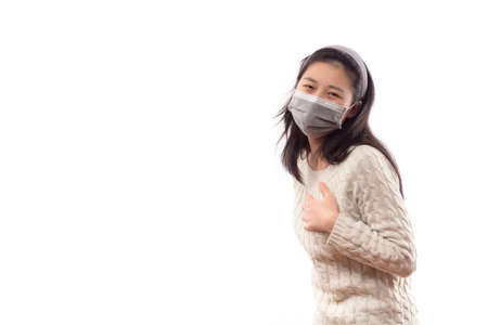 Sick woman blowing her nose isolated.の写真素材
