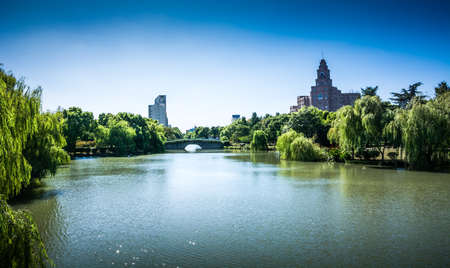 city road through modern buildings in beijingの写真素材