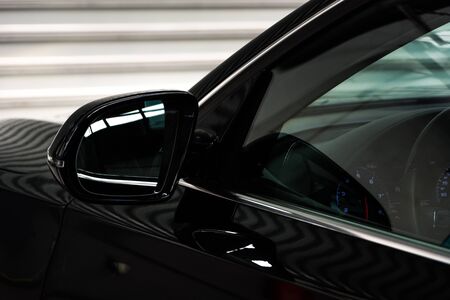 side rear-view mirror on a modern carの写真素材