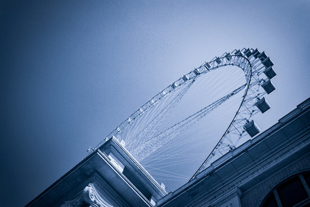 Ferris wheel on cloudy sky backgroundのeditorial素材