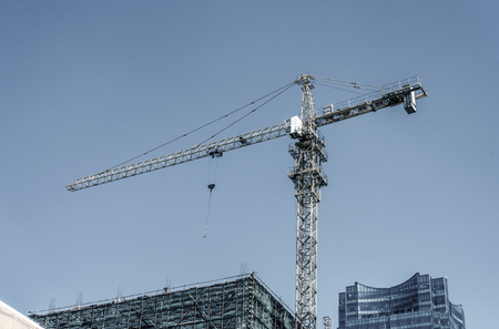 Construction site with cranes on sky backgroundのeditorial素材