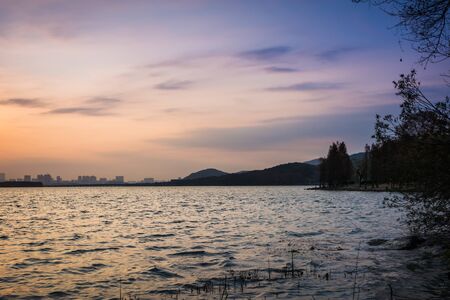 morning sunrise city skyline park lake clear calm waterの写真素材