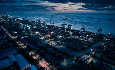 shanghai container terminal at nightfallの写真素材
