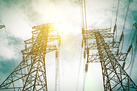 electricity high voltage pole and skyの写真素材