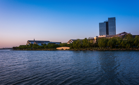 office building near the lake in sunsetの写真素材